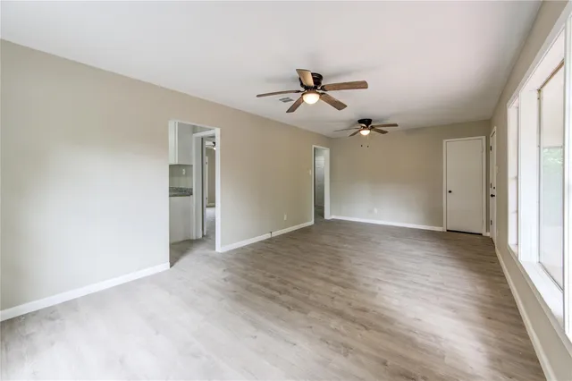 a view of a kitchen with granite countertop cabinets and a window