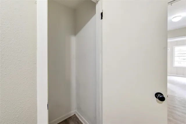 a view of a bathroom with toilet a sink and a mirror