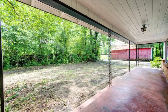 a view of a back yard from a porch
