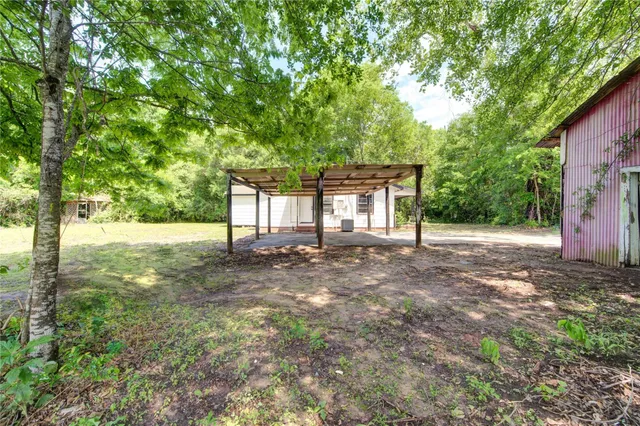 a house that has a tree in front of it