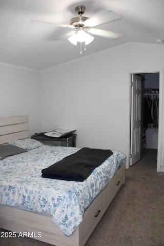 a view of room with a ceiling fan