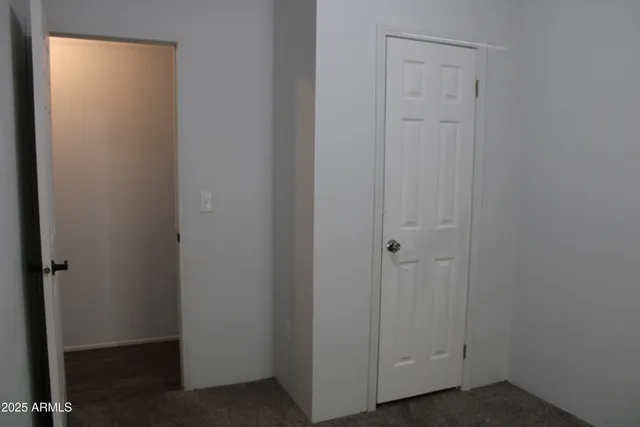 a white toilet sitting next to a shower curtain