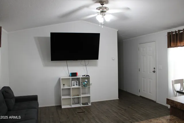 a view of a livingroom with furniture and wooden floor