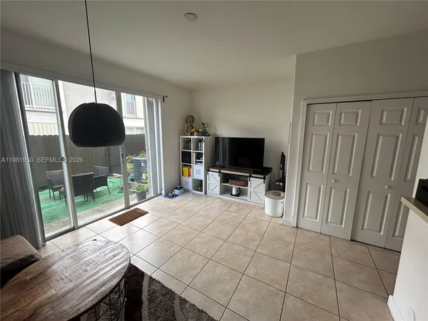 a room with furniture and a flat screen tv