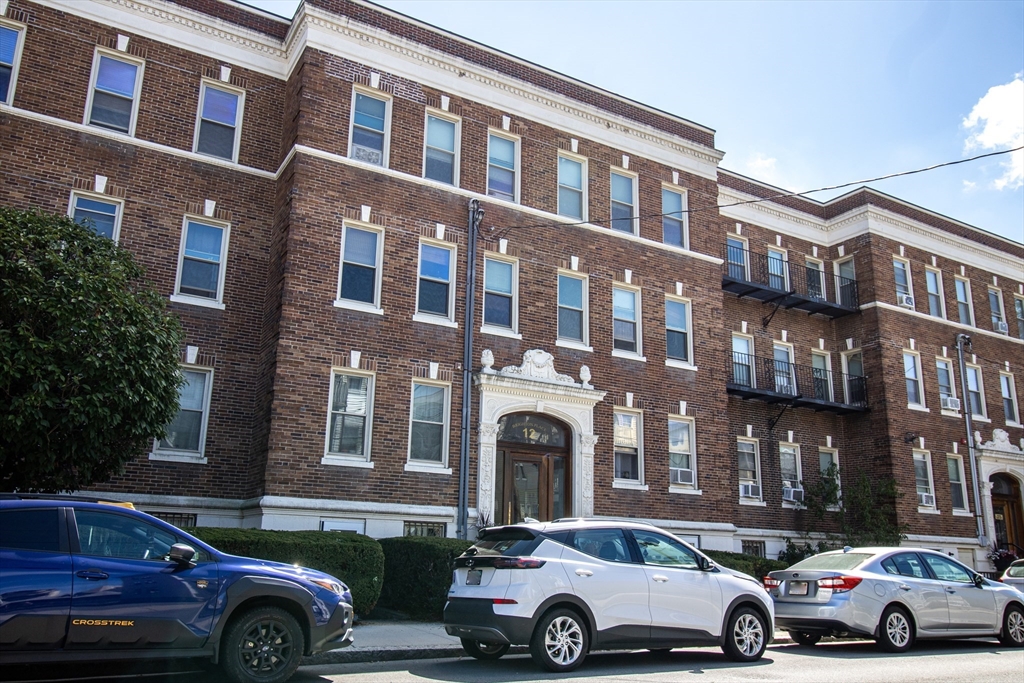 12 Ransom Road, Unit 6 Boston, MA 02135 - Photo 16 of 16 a car parked in front of a building