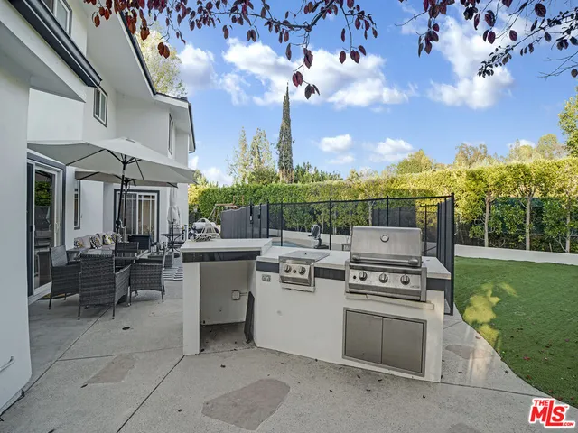 a view of a kitchen with a stove and a table