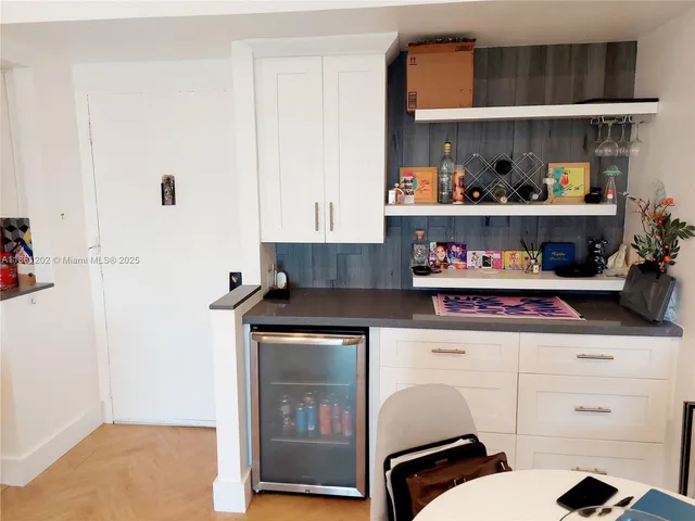 a kitchen with stainless steel appliances a stove and cabinets