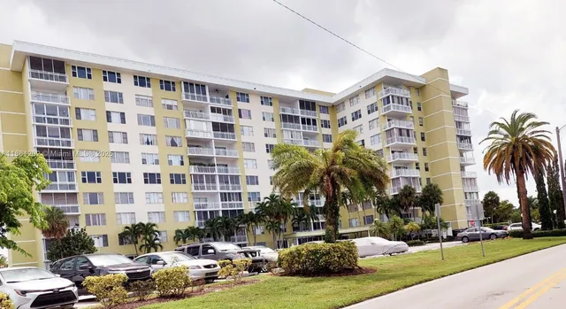 a city view with tall buildings and a yard