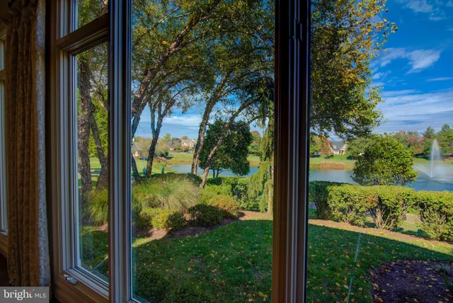 a view of an entryway with wooden floor and windows