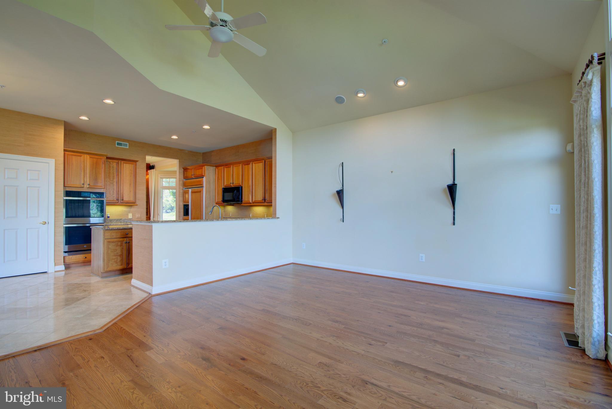 43462 Firestone Place Leesburg, VA 20176 - Photo 19 of 80 a view of a kitchen with a sink and a refrigerator