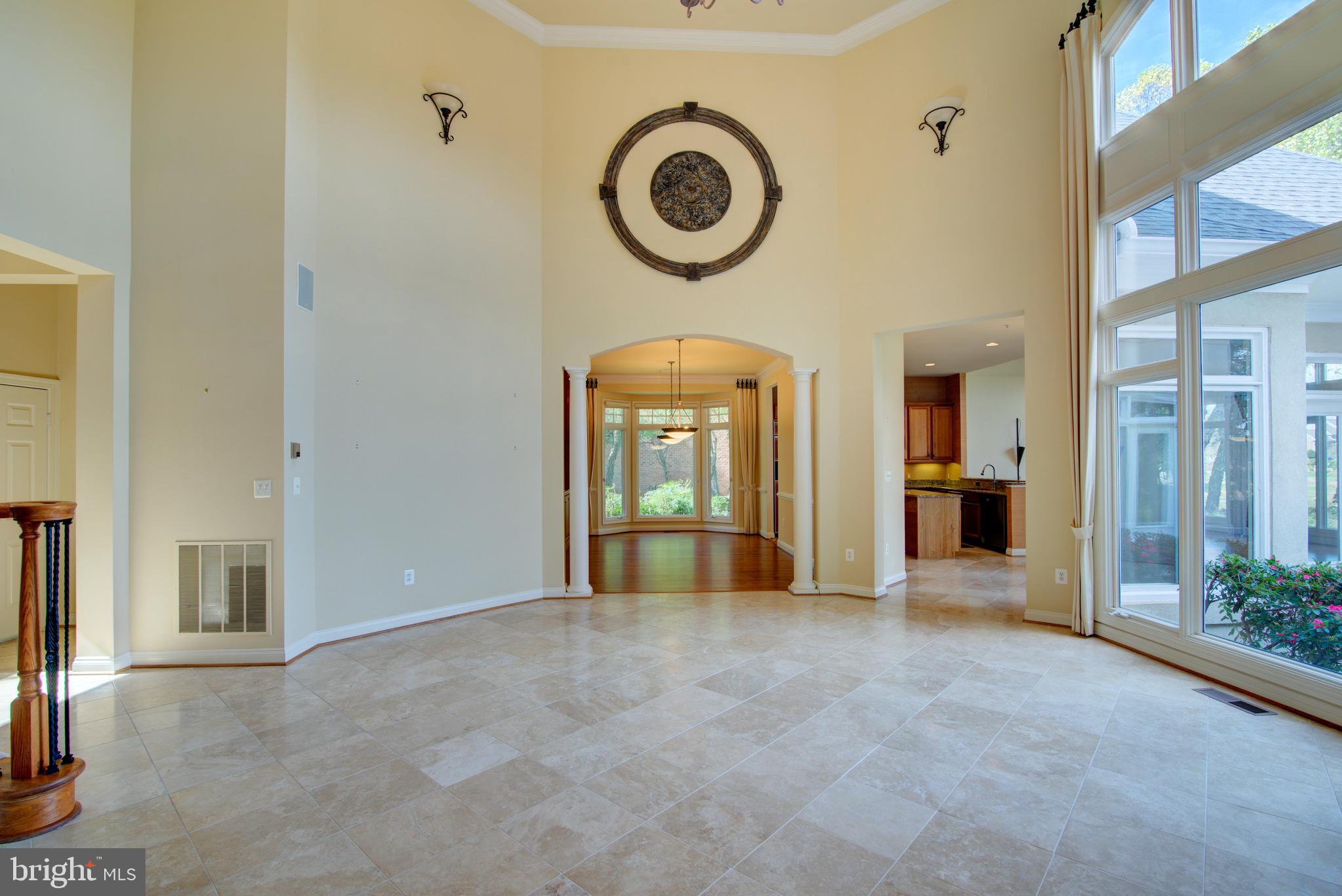43462 Firestone Place Leesburg, VA 20176 - Photo 21 of 80 a view of an empty room with a fireplace and a window