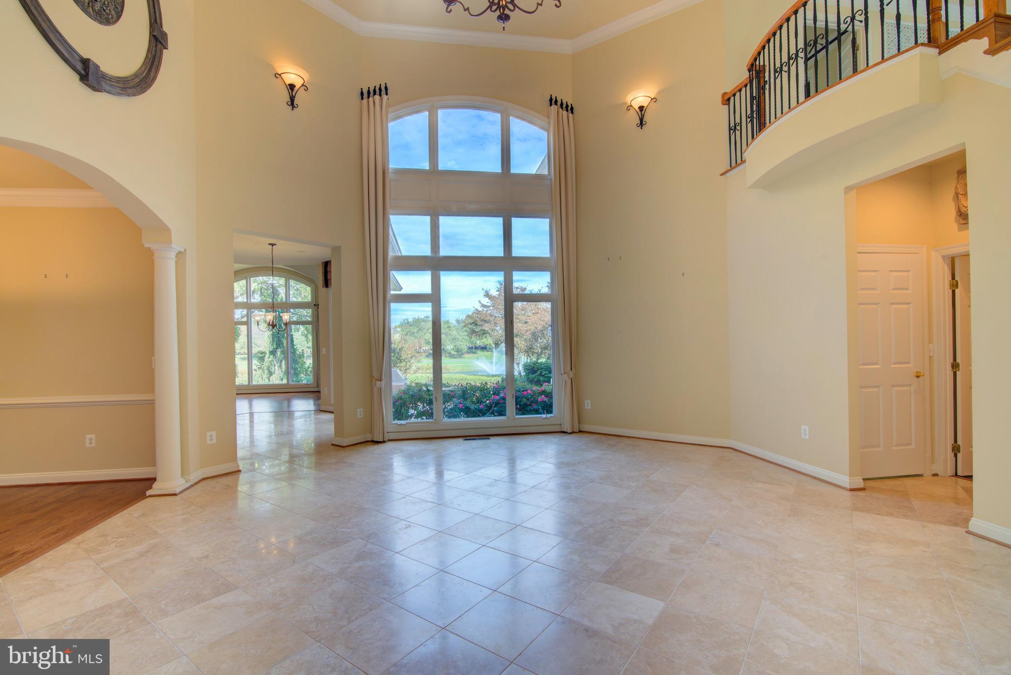 43462 Firestone Place Leesburg, VA 20176 - Photo 22 of 80 a view of an empty room with glass door and a window