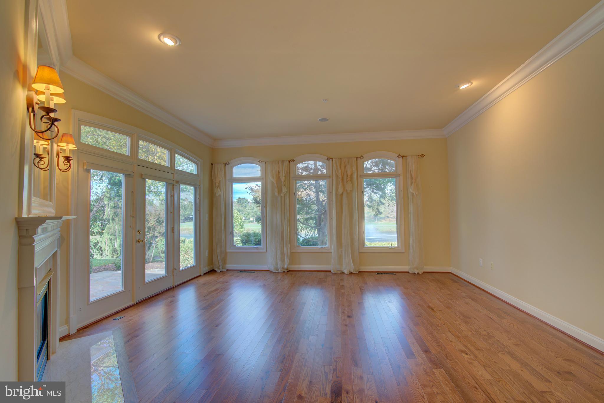 43462 Firestone Place Leesburg, VA 20176 - Photo 25 of 80 a view of an empty room with wooden floor and a window