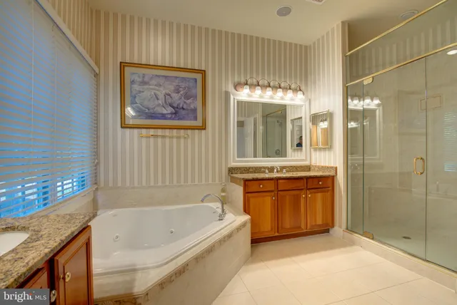 a view of empty room with kitchen and window