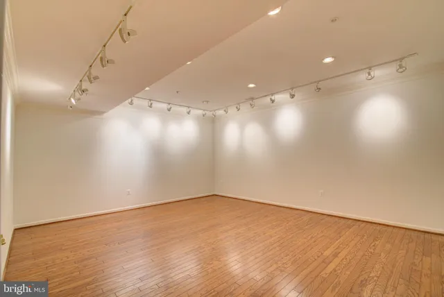 a view of a swimming pool with a yard and plants