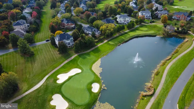 a view of a kitchen with a sink and a large window