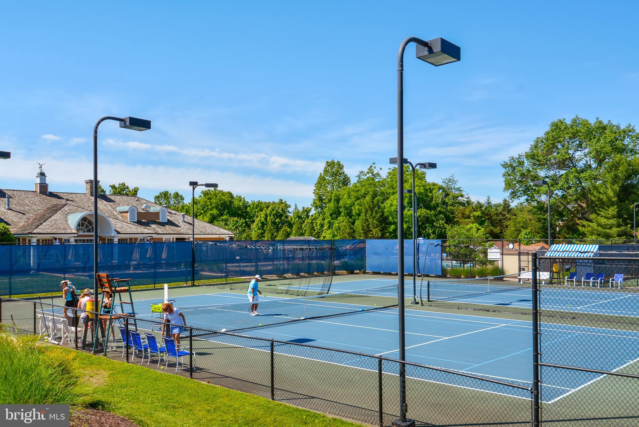 43462 Firestone Place Leesburg, VA 20176 - Photo 74 of 80 a view of a swimming pool with a patio and a fountain