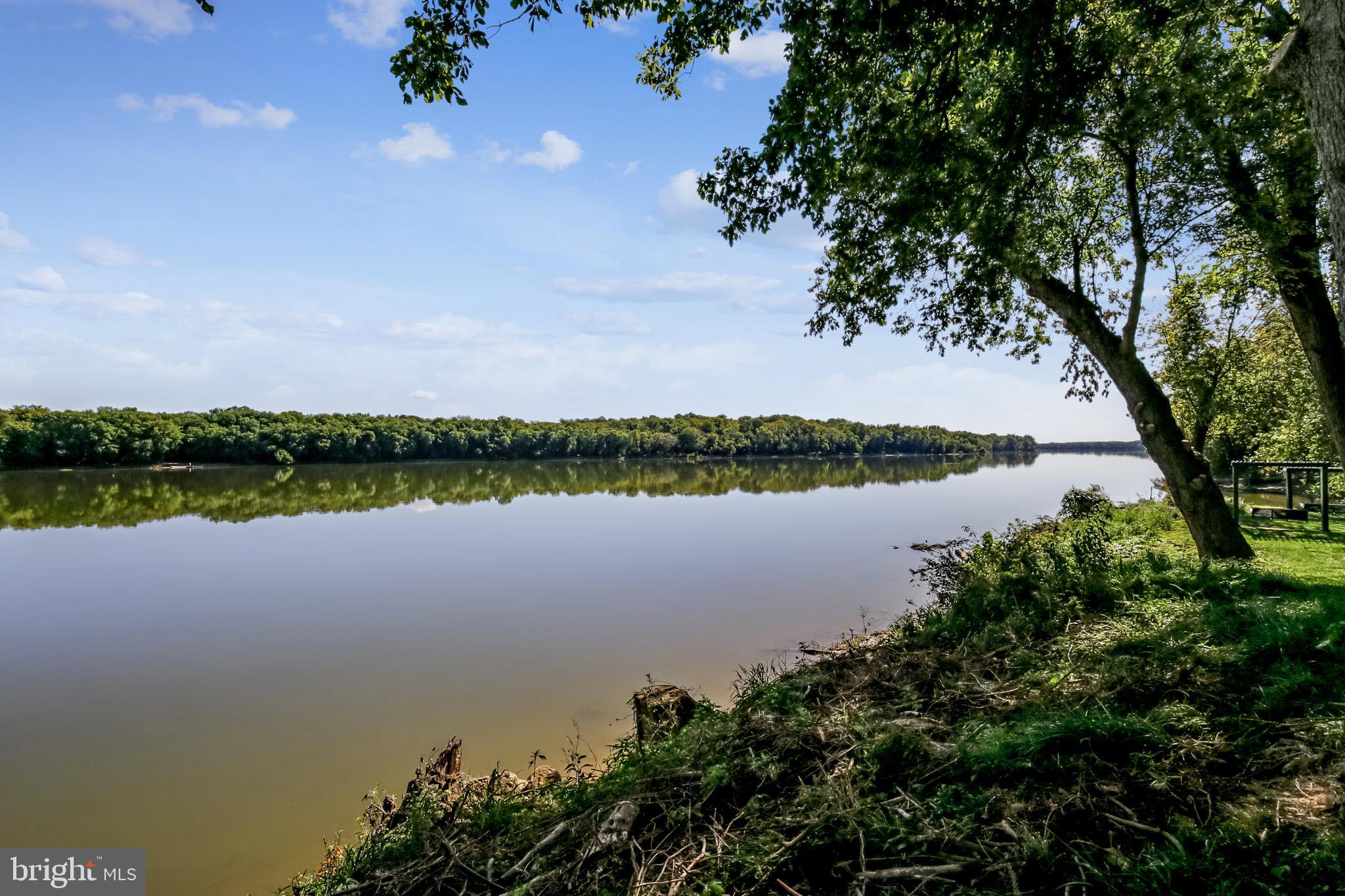 43462 Firestone Place Leesburg, VA 20176 - Photo 78 of 80 a view of a lake with houses in the background