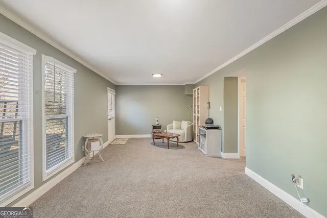 a view of livingroom with furniture and window