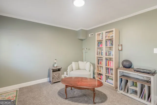 a room with furniture and a book shelf