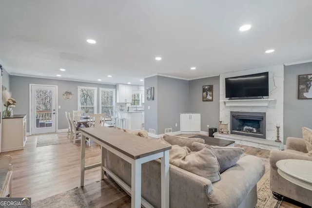 a living room with furniture and a fireplace