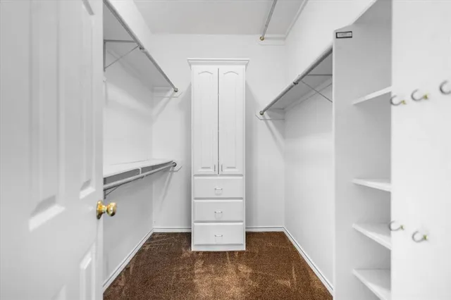 a living room with fireplace furniture and a chandelier