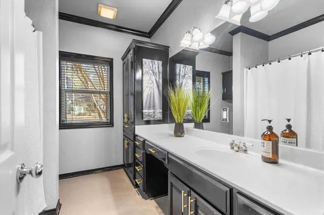 a view of storage and utility room with window