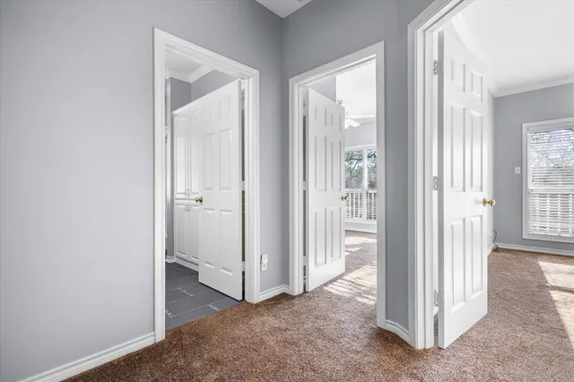 a view of a livingroom with a ceiling fan and window