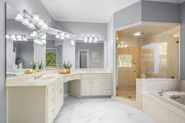 a large bathroom with a sink a large mirror and a shower