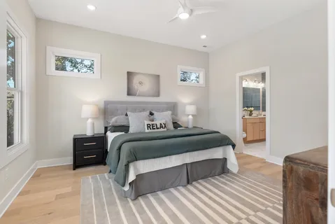 a bathroom with a toilet a sink and a mirror