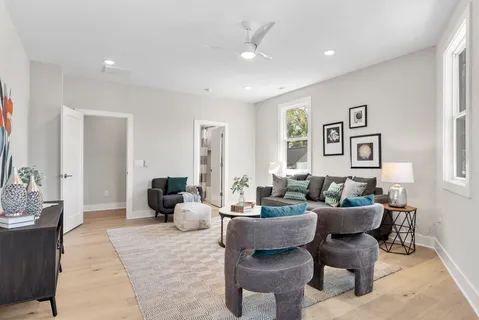 a living room with furniture and a table