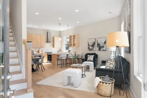 a kitchen with a sink cabinets and wooden floor