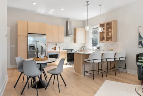 a kitchen with a sink stove and cabinets