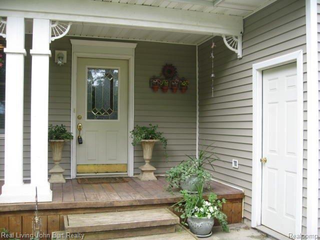1490 Miller Road Lake Orion, MI 48362 - Photo 2 of 25 Porch & side entry garage