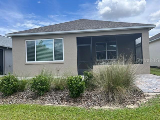 7978 Southwest 90th Terrace Ocala, FL 34481 - Photo 19 of 20 a front view of a house with garden