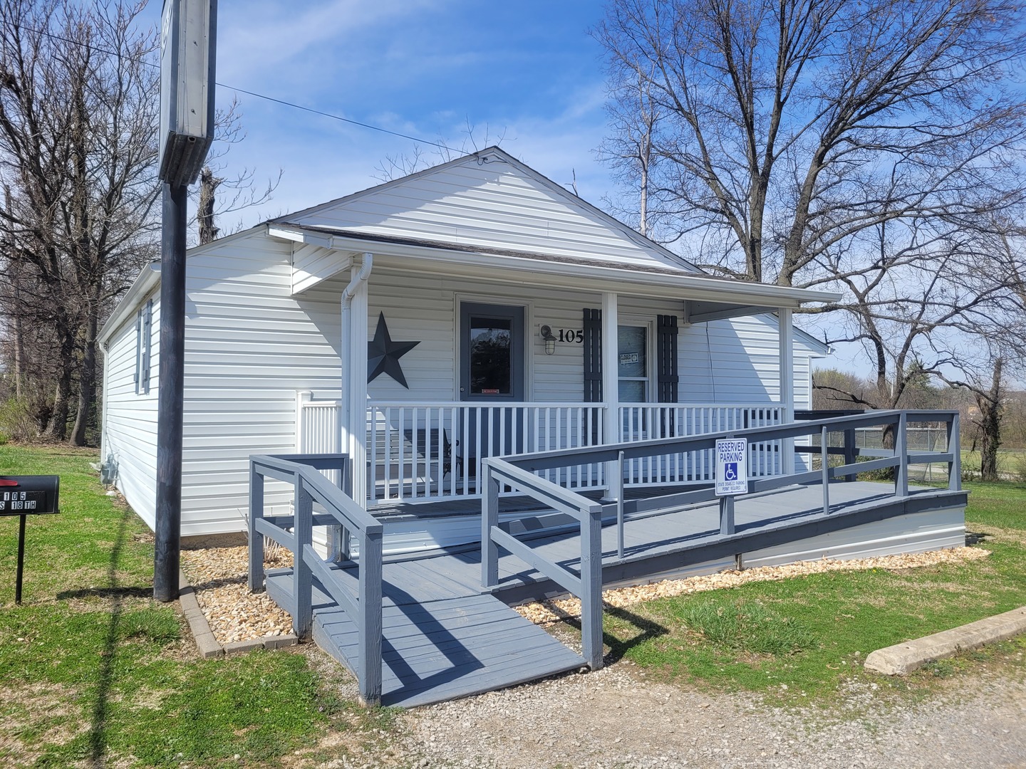 105 18th Street Mount Vernon, IL 62864 - Photo 1 of 16 a view of a house with a wooden deck and a yard
