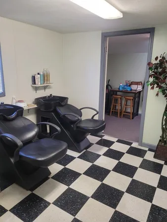 a living room with a black white checkered floor
