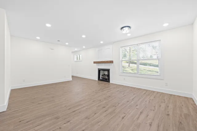 a view of a kitchen with a sink and a refrigerator