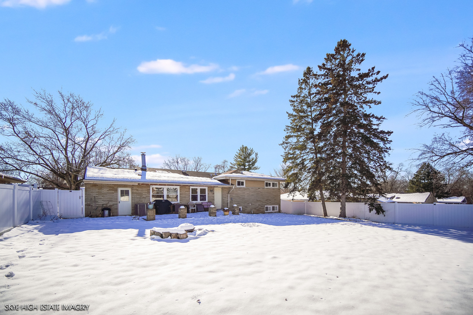 113 April Lane North Aurora, IL 60542 - Photo 19 of 23 a view of house with a yard covered in snow