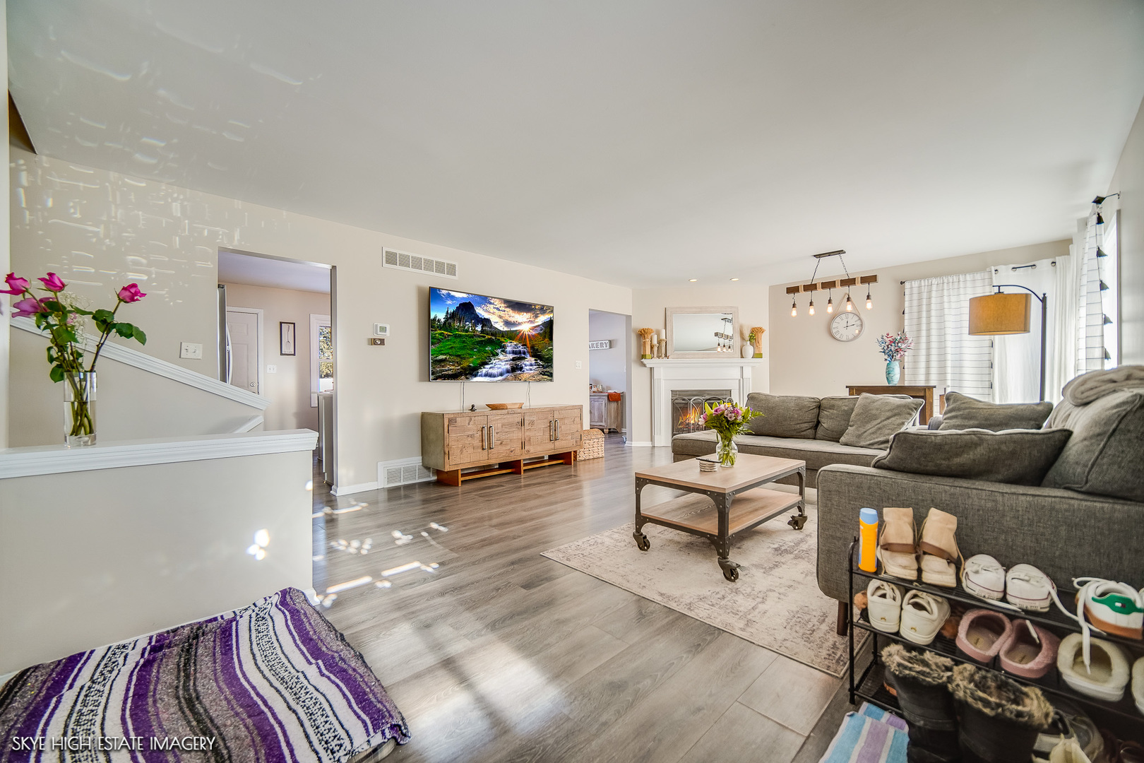 113 April Lane North Aurora, IL 60542 - Photo 2 of 23 a living room with furniture and a flat screen tv