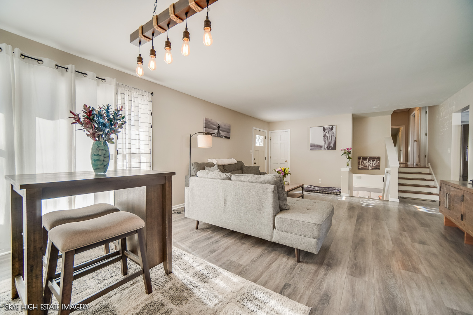 113 April Lane North Aurora, IL 60542 - Photo 3 of 23 a living room with furniture and wooden floor