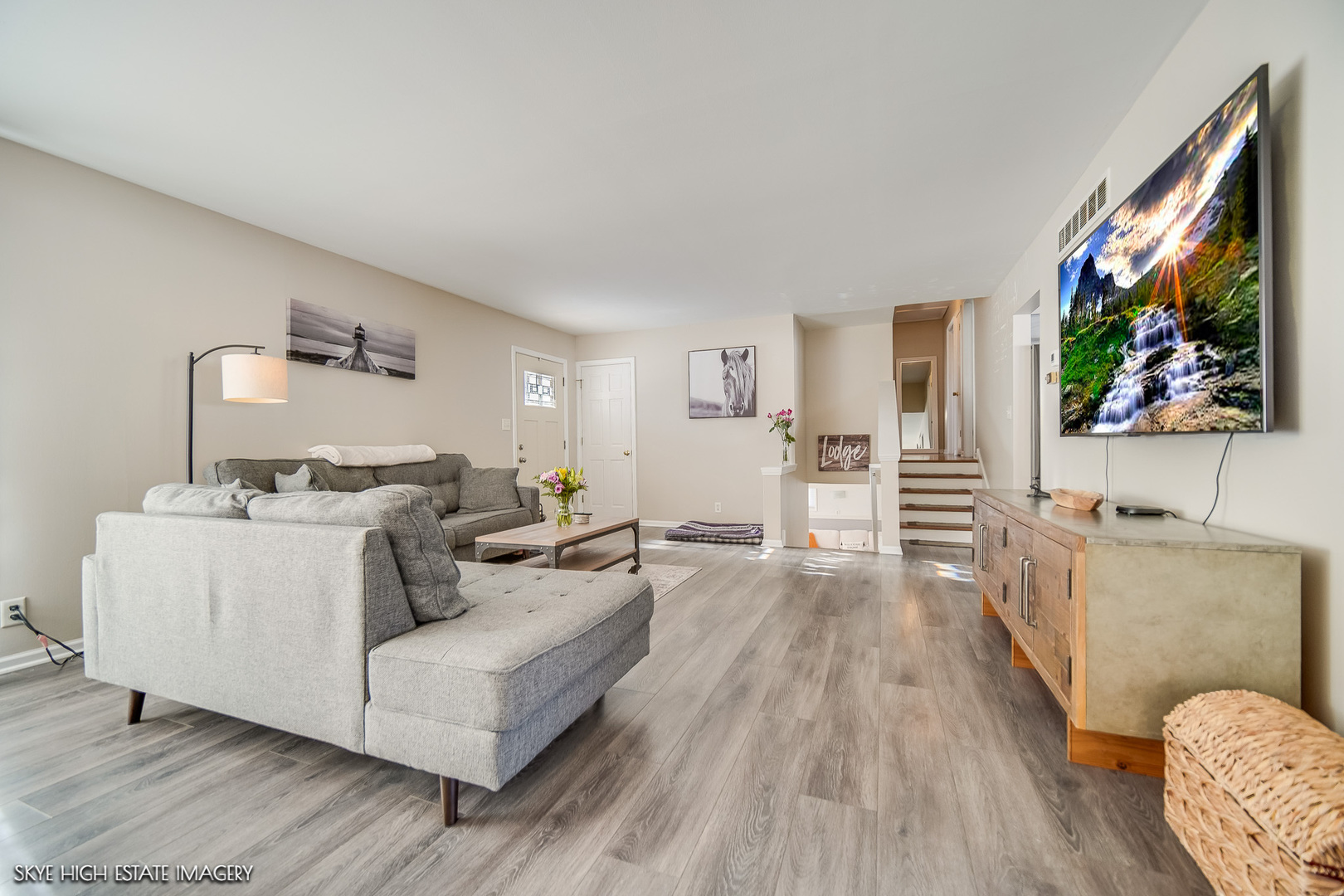 113 April Lane North Aurora, IL 60542 - Photo 4 of 23 a living room with furniture and a flat screen tv
