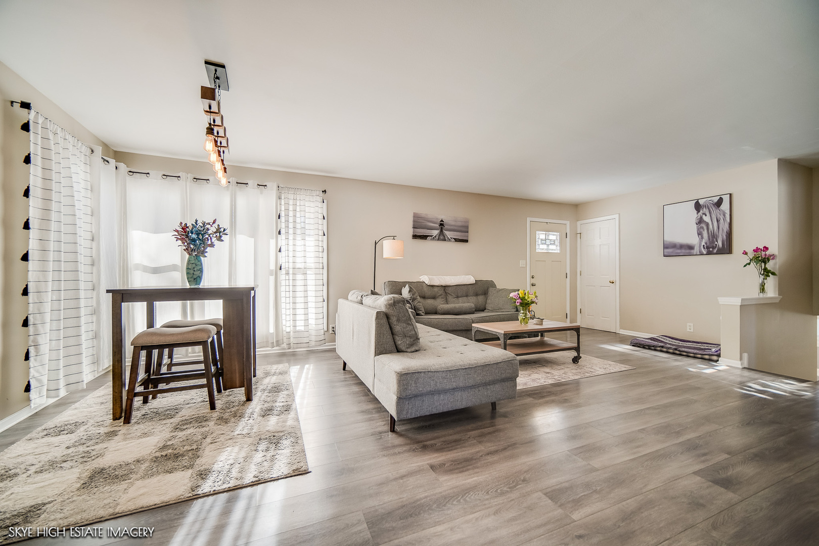 113 April Lane North Aurora, IL 60542 - Photo 5 of 23 a living room with furniture and a chandelier