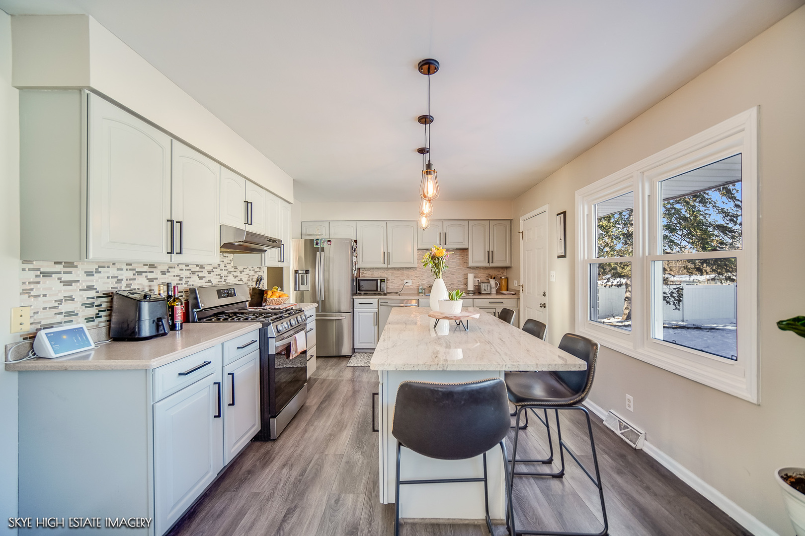 113 April Lane North Aurora, IL 60542 - Photo 9 of 23 a large white kitchen with stainless steel appliances