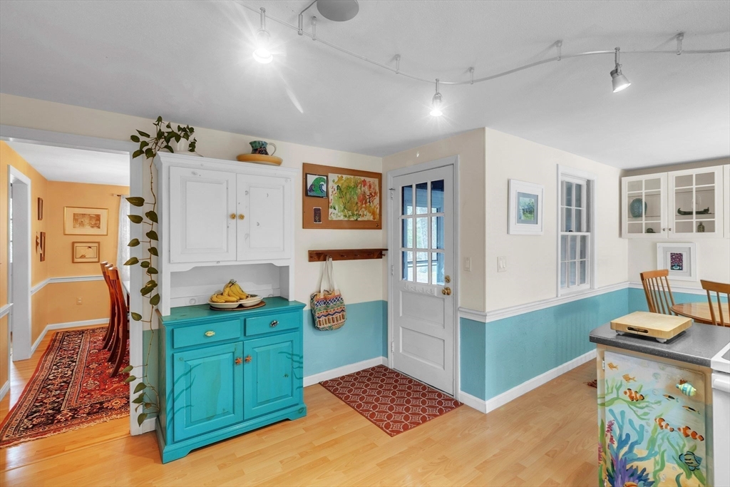 64 Heatherstone Road Amherst, MA 01002 - Photo 12 of 42 a view of kitchen with furniture and wooden floor