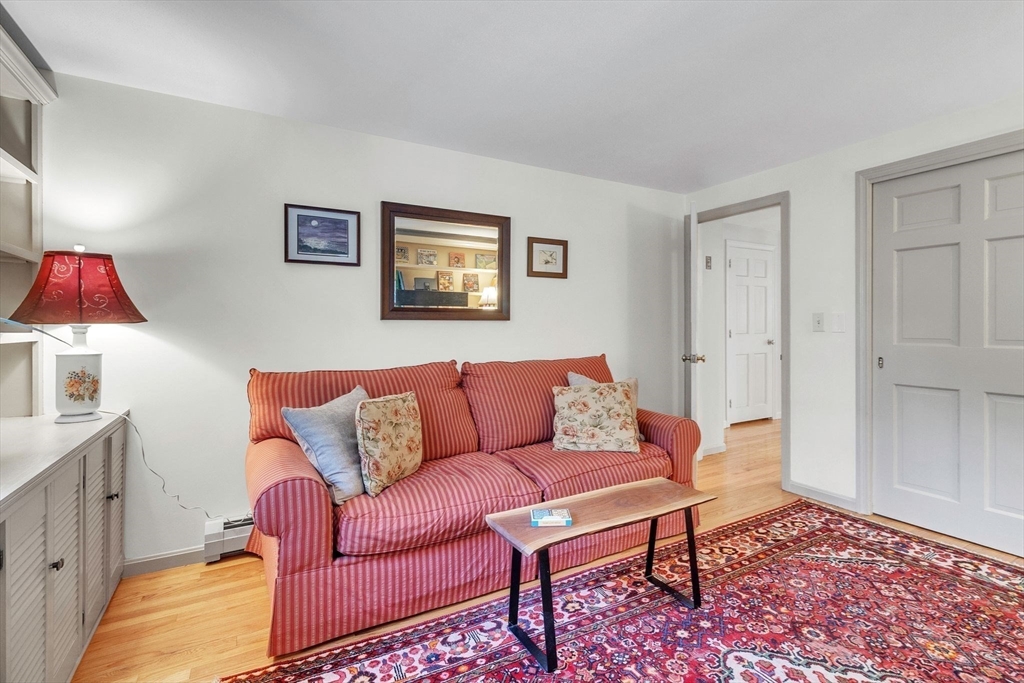 64 Heatherstone Road Amherst, MA 01002 - Photo 18 of 42 a living room with furniture and a rug