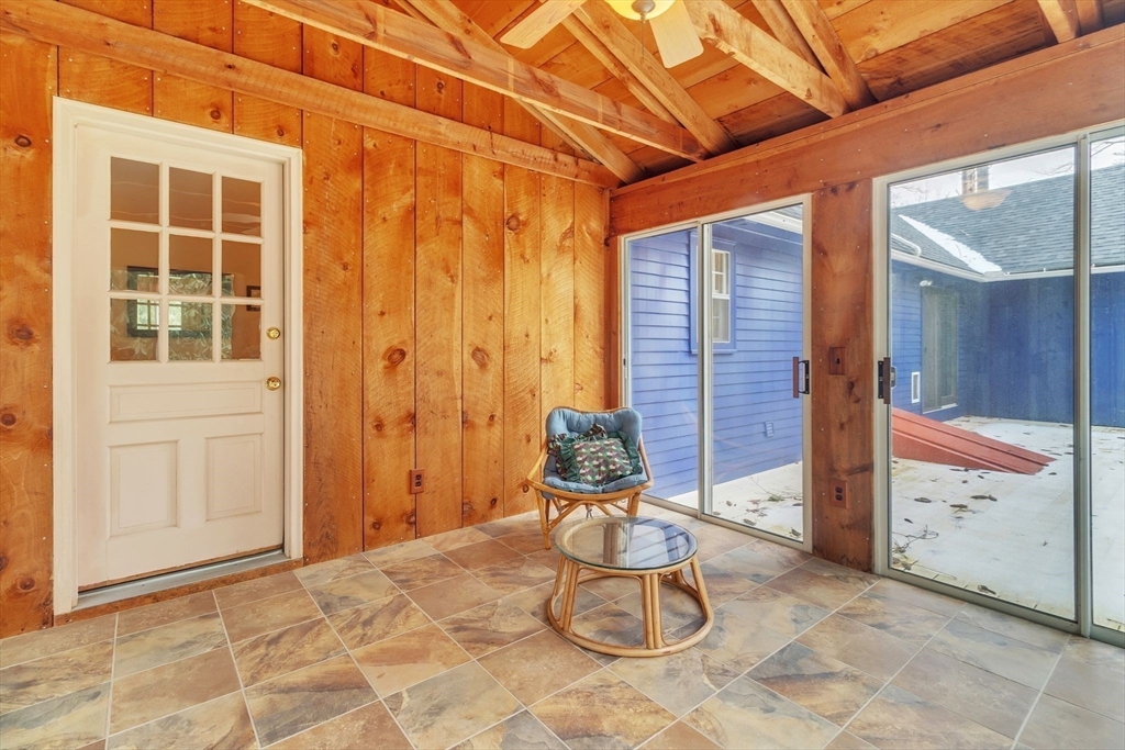 64 Heatherstone Road Amherst, MA 01002 - Photo 20 of 42 a view of a porch with a table and chair