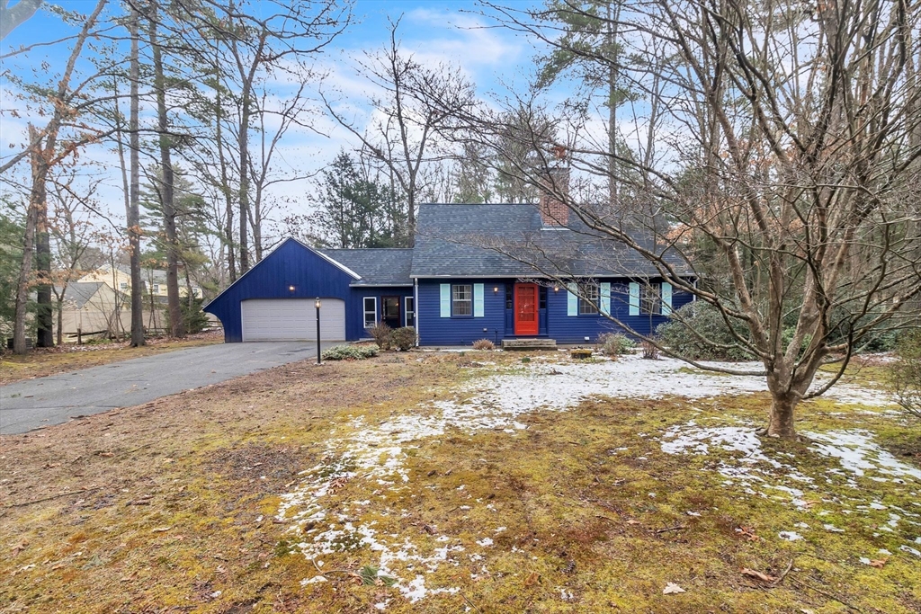 64 Heatherstone Road Amherst, MA 01002 - Photo 2 of 42 a front view of a house with a yard covered in snow