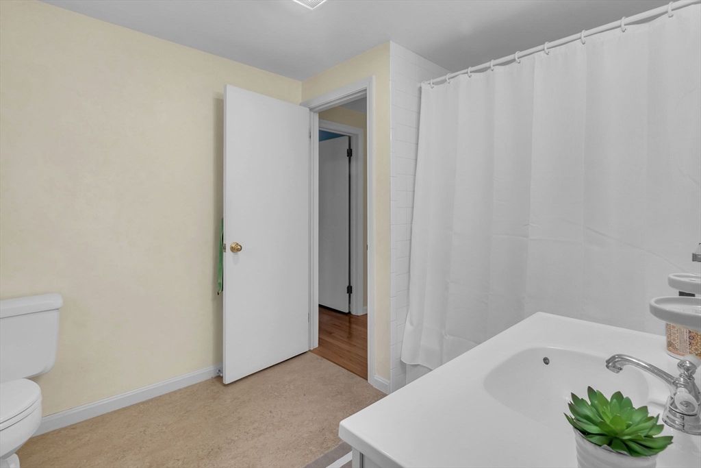 64 Heatherstone Road Amherst, MA 01002 - Photo 25 of 42 a bathroom with a white tub