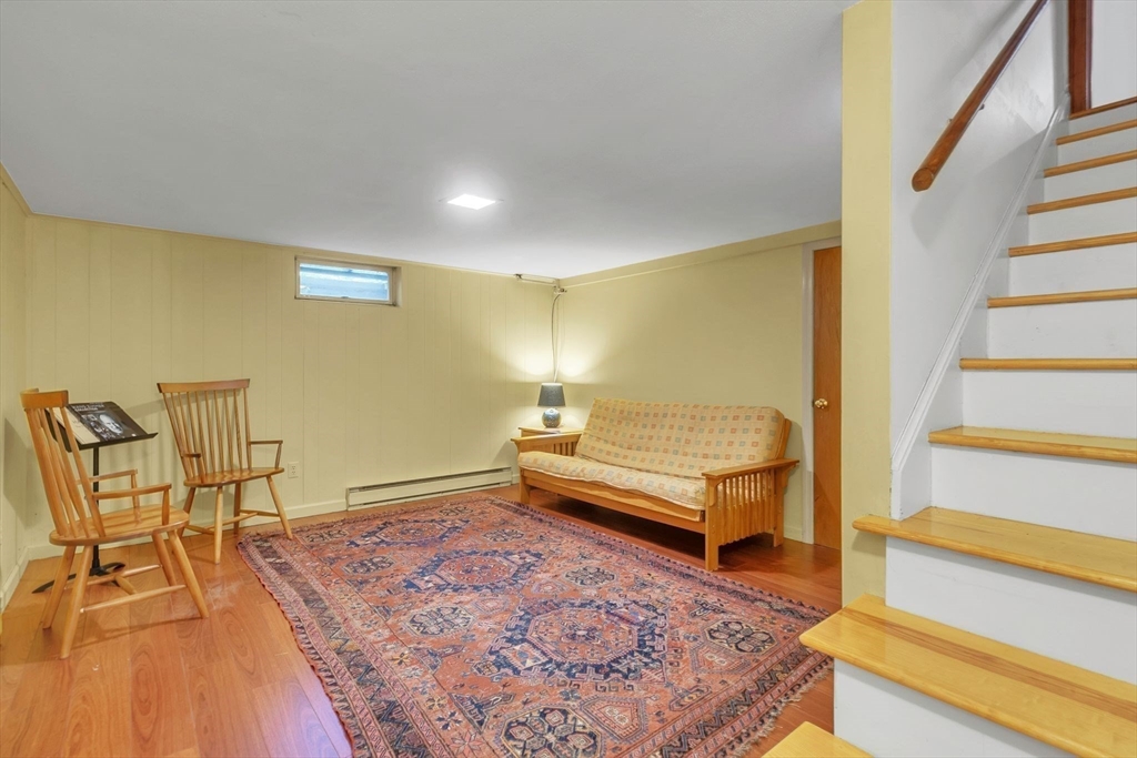 64 Heatherstone Road Amherst, MA 01002 - Photo 31 of 42 a spacious bedroom with a bed and wooden floor